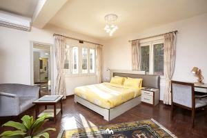Postel nebo postele na pokoji v ubytování Ranikunj Boutique Hotel