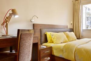 Postel nebo postele na pokoji v ubytování Ranikunj Boutique Hotel