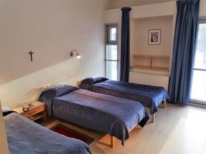 Postel nebo postele na pokoji v ubytování Pirita Klooster Guest House