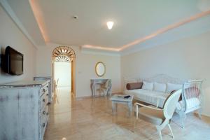 a living room with a couch and a table at Hotel Azimut in Sveti Stefan