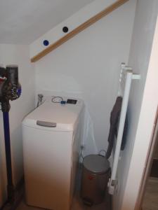 a small bathroom with a toilet and a pole at Le chalet du Sersas in Saint-Clément sur Durance +23 photos