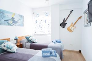 Posteľ alebo postele v izbe v ubytovaní Apartamento Lujo frente al Mar Centro de Malaga