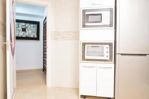 Kuchyňa alebo kuchynka v ubytovaní Apartamento Lujo frente al Mar Centro de Malaga