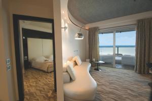 Кровать или кровати в номере Hotel Premier & Suites - Premier Resort