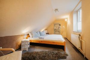a bedroom with a bed in a room at Ferienhaus St. Andreasberg in Sankt Andreasberg