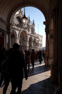 a group of people walking through a building at San Marco Superior Apartments in Venice