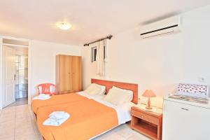 A bed or beds in a room at Angelina Studio