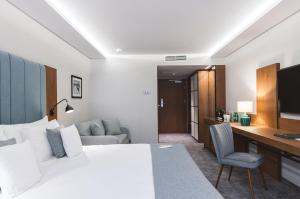 Llit o llits en una habitació de Green Mountain 5* Hotel