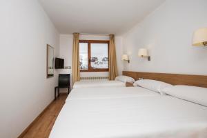 Voodi või voodid majutusasutuse Hotel Catalunya Ski toas