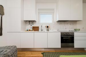A cozinha ou kitchenette de Graça Riverview Terrace Apartment
