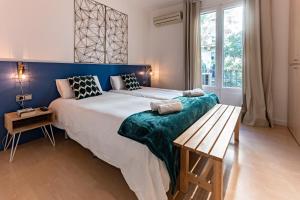 
Een bed of bedden in een kamer bij Habitat Apartments Barceloneta
