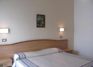Postel nebo postele na pokoji v ubytování Albergo Moretti