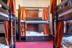 a group of bunk beds in a room at Palmers Lodge Swiss Cottage in London