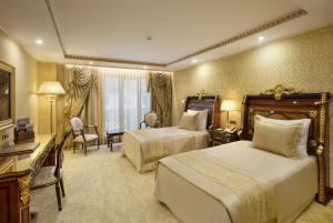 Postel nebo postele na pokoji v ubytování Ottoman's Life Hotel Deluxe