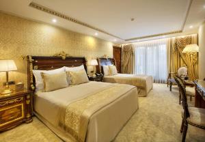 Postel nebo postele na pokoji v ubytování Ottoman's Life Hotel Deluxe