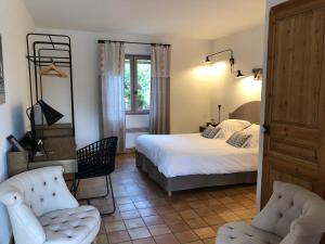 Postel nebo postele na pokoji v ubytování B&B La Badelle