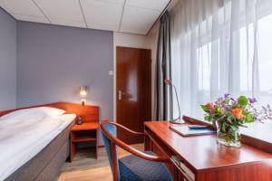 Voodi või voodid majutusasutuse Two Brothers Hotel Astoria toas