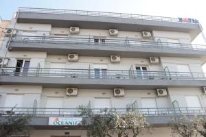 an apartment building with balconies on the side of it at Oceanis in Thessaloniki