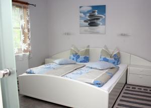 Ένα ή περισσότερα κρεβάτια σε δωμάτιο στο Ferienhaus Friedrichswalde