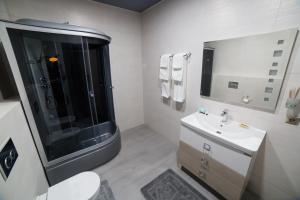 Vonios kambarys apgyvendinimo įstaigoje Golden Hotel