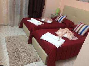 A bed or beds in a room at AFFITTACAMERE Il Cortile