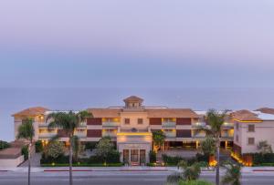 a large building with a view of the ocean at Malibu Beach Inn in Malibu