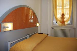 Postel nebo postele na pokoji v ubytování Hotel Adelchi