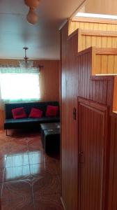 a living room with a couch and a window at Tres de junio in Puerto Montt