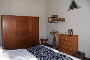 Posteľ alebo postele v izbe v ubytovaní Arany Szőlő Wellness Apartmanház