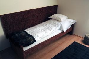 Posteľ alebo postele v izbe v ubytovaní Arany Szőlő Wellness Apartmanház