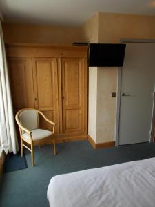Postel nebo postele na pokoji v ubytování Hotel Manitoba