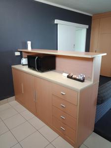 Kuchyň nebo kuchyňský kout v ubytování Annerley Motor Inn