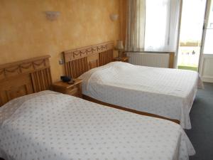 Postel nebo postele na pokoji v ubytování Hotel Manitoba
