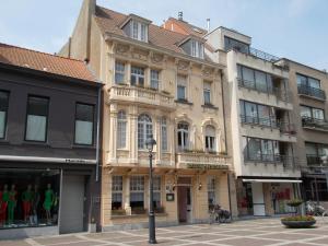 a group of buildings on a city street at Hotel Manitoba in Blankenberge