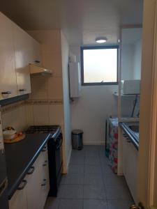 Η κουζίνα ή μικρή κουζίνα στο Departamento Mantagua