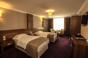 Cama o camas de una habitación en Grand Akçalı Otel