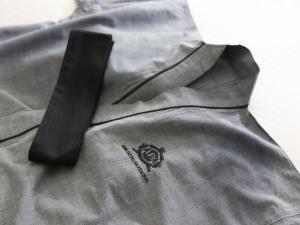 a black tie sitting on the back of a gray jacket at APA Hotel Kyoto Ekikita in Kyoto