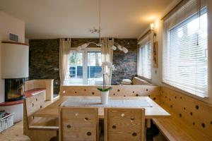 a dining room with a table and a window at Luxury apartment with a nice view in Kranjska Gora in Kranjska Gora