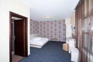 Postel nebo postele na pokoji v ubytování Albert Hotel
