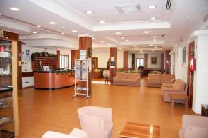 a lobby with couches and chairs in a building at Albergo San Michele in San Giovanni Rotondo