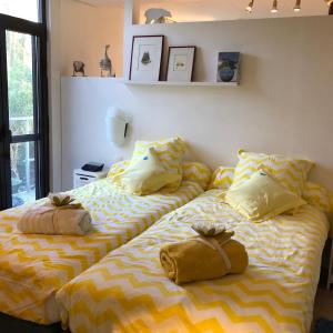 Кровать или кровати в номере Linden-Jachthoorn