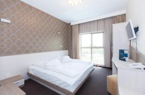 Postel nebo postele na pokoji v ubytování Albert Hotel