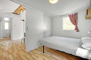A bed or beds in a room at Camping Fusina