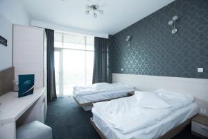 Postel nebo postele na pokoji v ubytování Albert Hotel