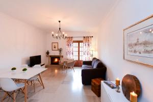 a living room with a couch and a table at Sintra 23 in Sintra