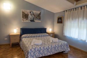 Postel nebo postele na pokoji v ubytování BB La Bella Addormentata e il Principe Calaf