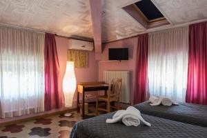 Postel nebo postele na pokoji v ubytování BB La Bella Addormentata e il Principe Calaf