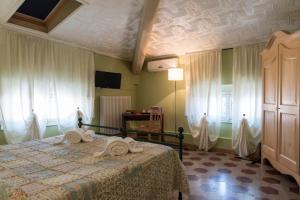 Postel nebo postele na pokoji v ubytování BB La Bella Addormentata e il Principe Calaf