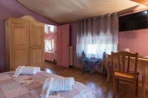 Postel nebo postele na pokoji v ubytování BB La Bella Addormentata e il Principe Calaf
