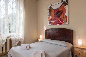 Postel nebo postele na pokoji v ubytování BB La Bella Addormentata e il Principe Calaf